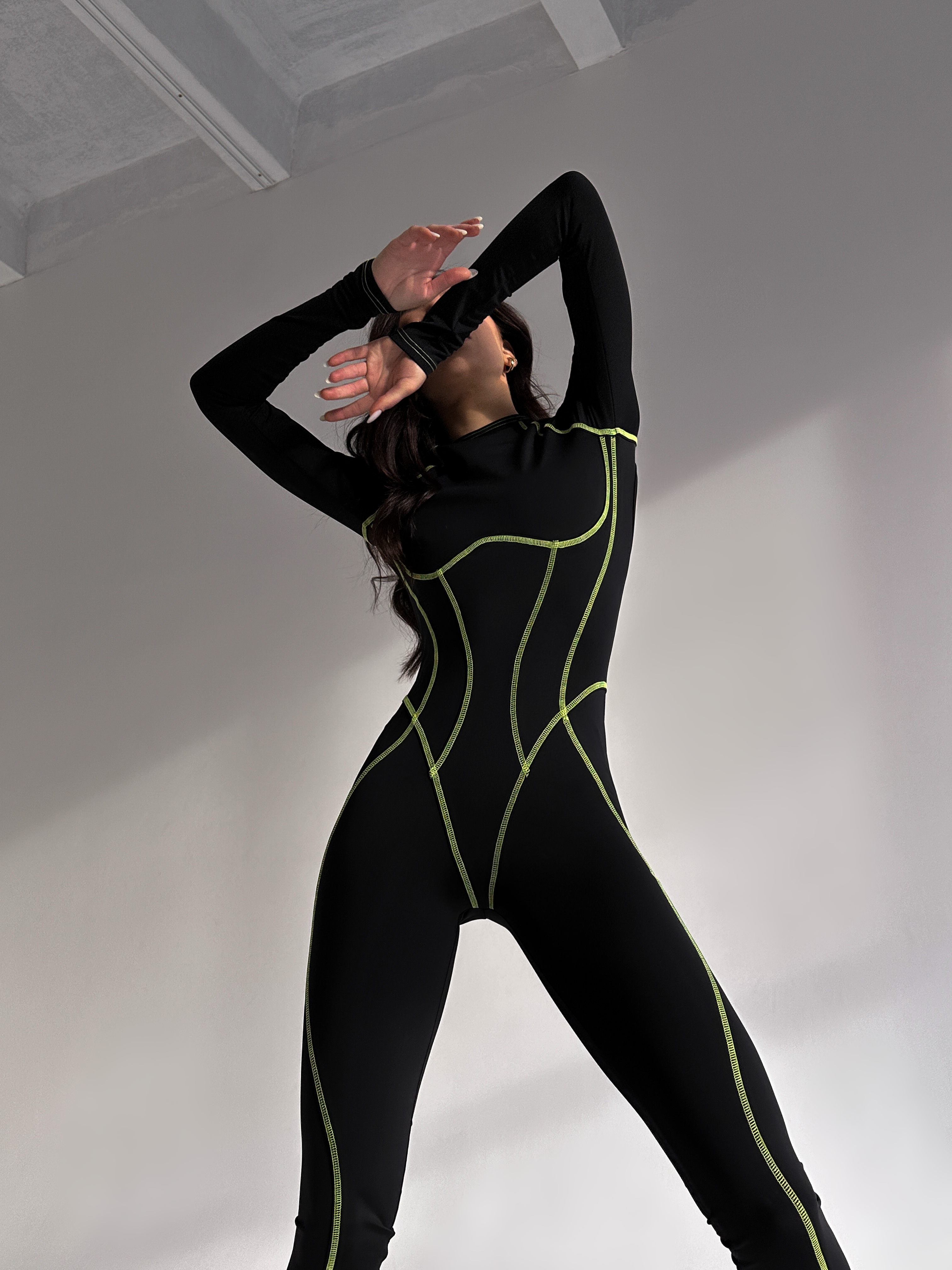 Galaxy Contour Seam Open Back Long Sleeve Jumpsuit in Black and Neon Green