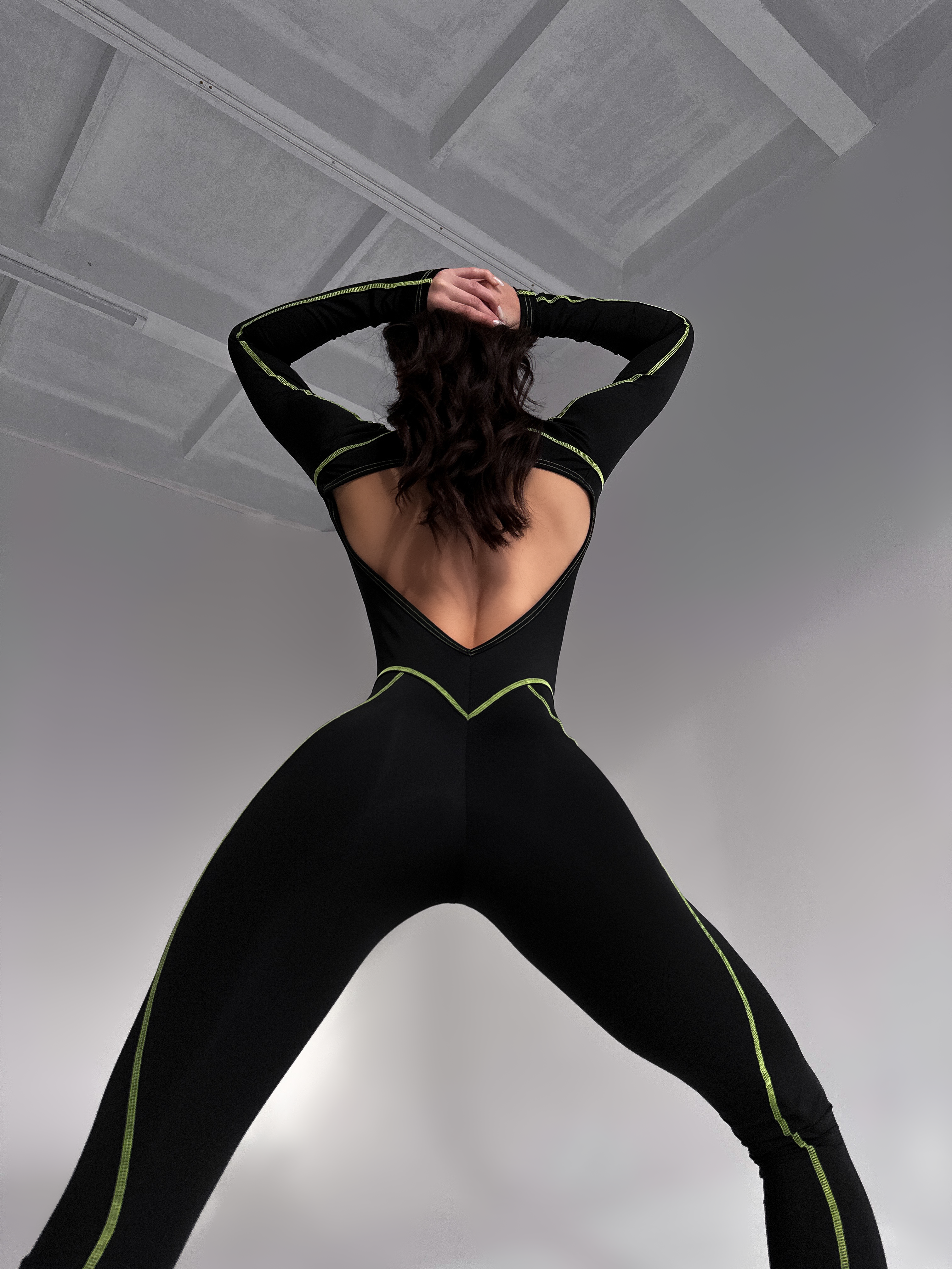 Galaxy Contour Seam Open Back Long Sleeve Jumpsuit in Black and Neon Green